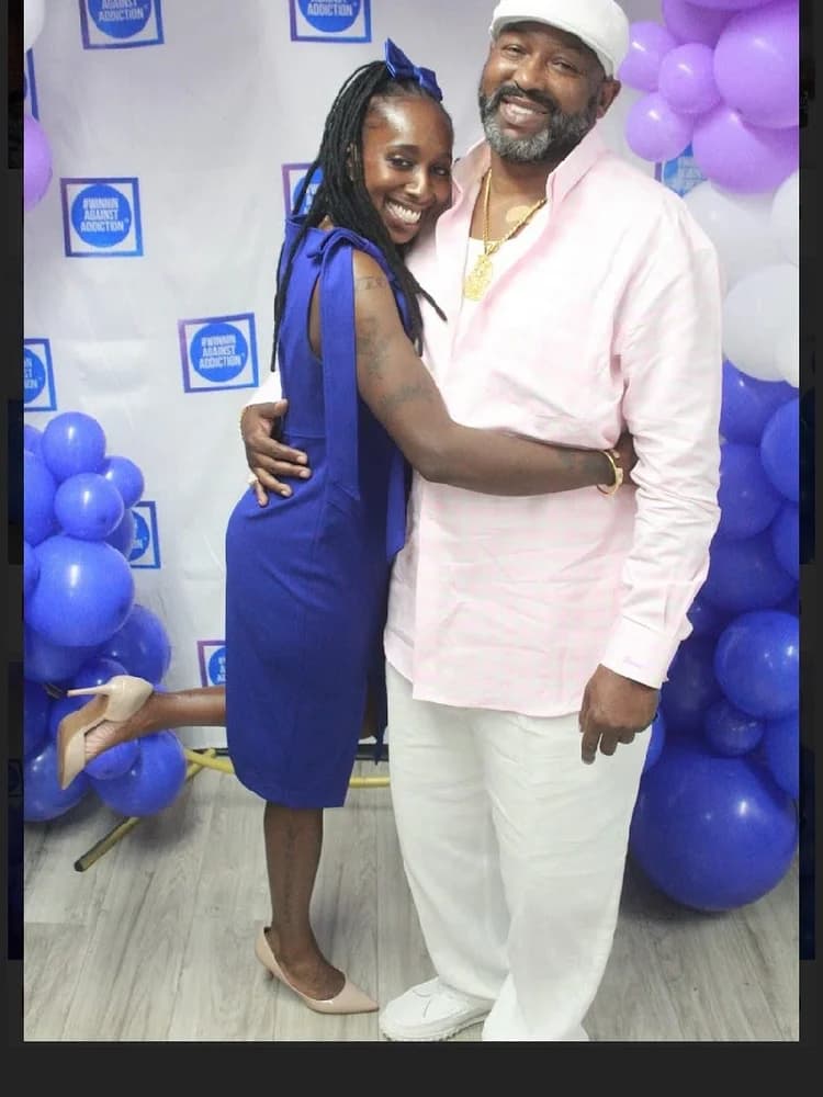 Past gala attendees celebrating at Winnin Against Addiction formal event with purple balloons