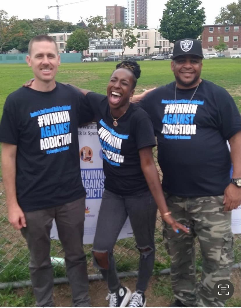 2023 walk participants in Winnin Against Addiction shirts at Boston recovery awareness event