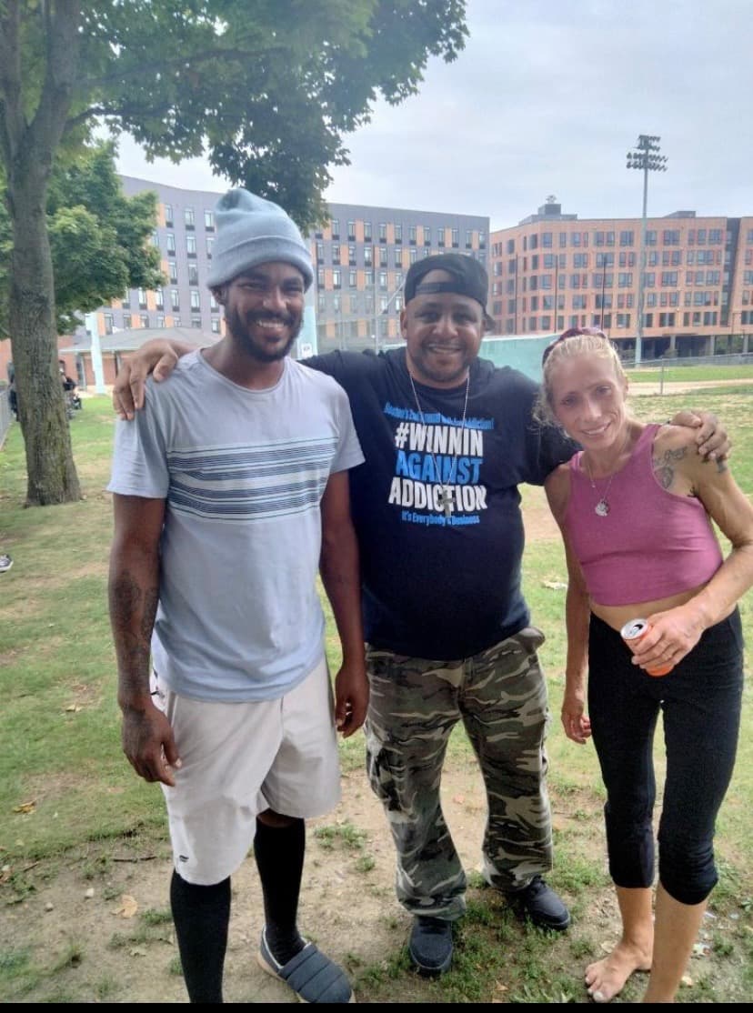 2023 community walk participants celebrating recovery at Winnin Against Addiction outdoor event in Boston