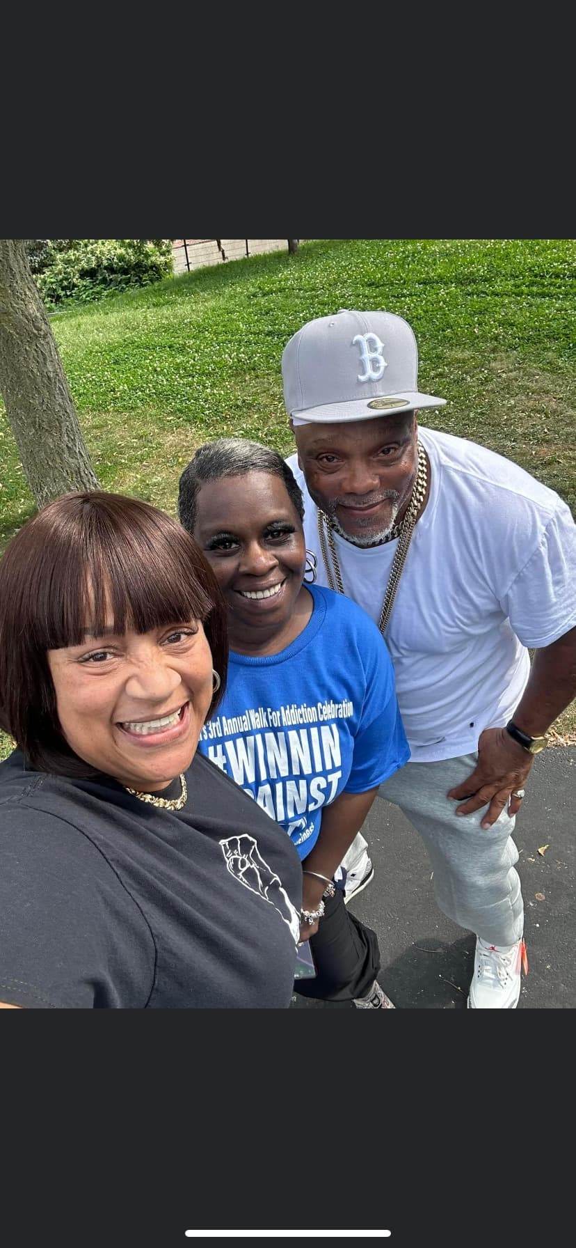 2022 Winnin Against Addiction community walk participants smiling together at Boston outdoor event