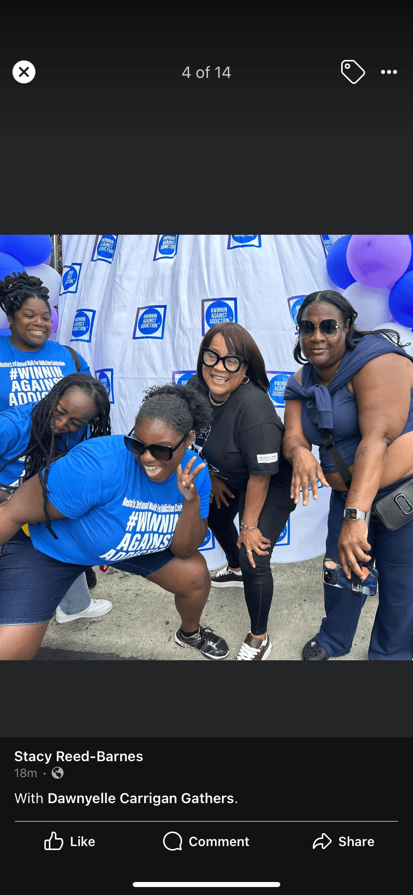 2022 Winnin Against Addiction community members with blue shirts at outdoor event with balloons in Boston