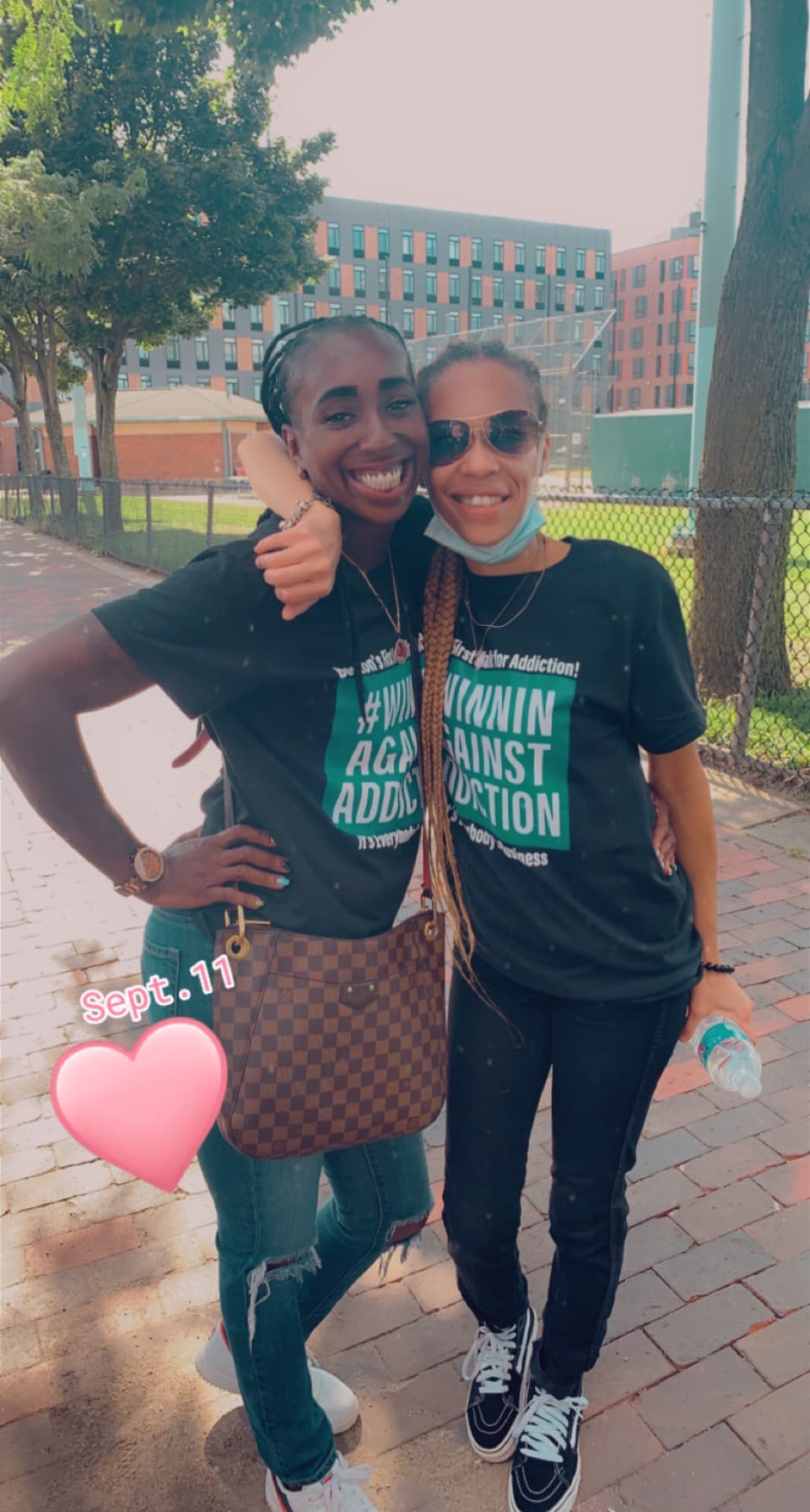 2021 September First Annual Walk participants wearing green Winnin Against Addiction shirts in Boston park