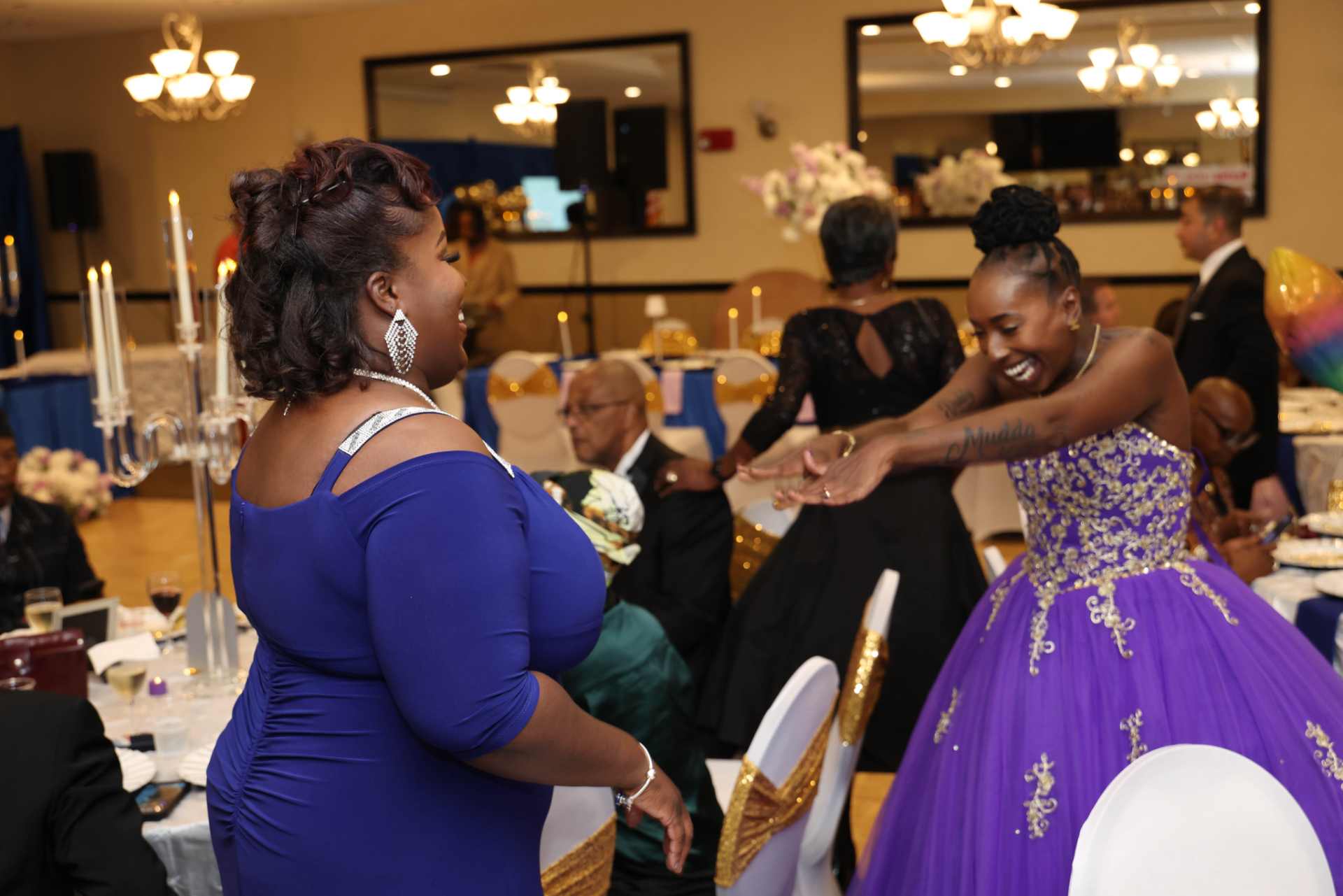 Renarda Huggins embracing a community member at the Winnin' Against Addiction 2025 Gala