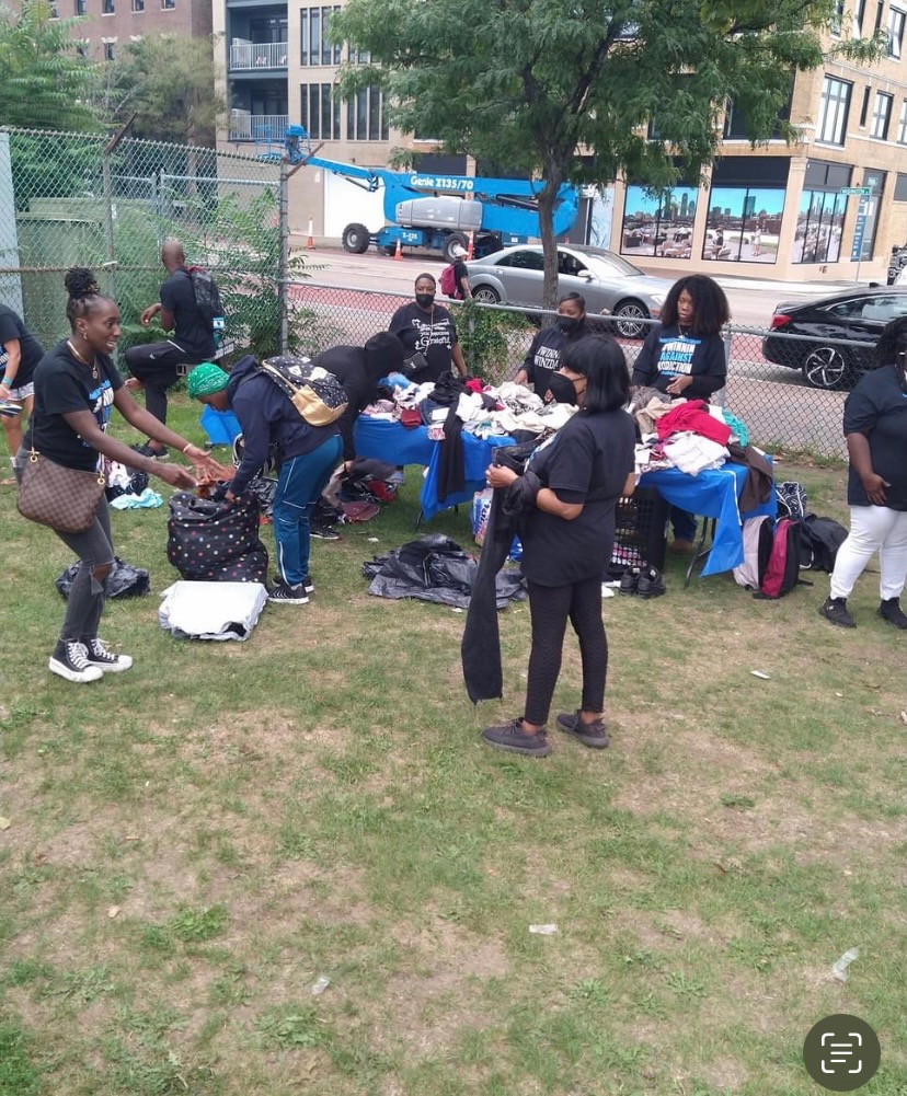 2023 Winnin Against Addiction volunteers distributing clothing and resources at Boston community outreach