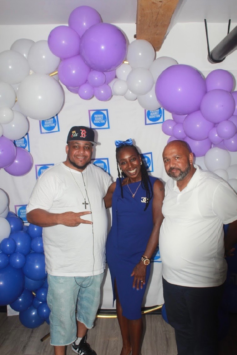 2024 supporters celebrating hope and healing at Winnin Against Addiction gala photo backdrop