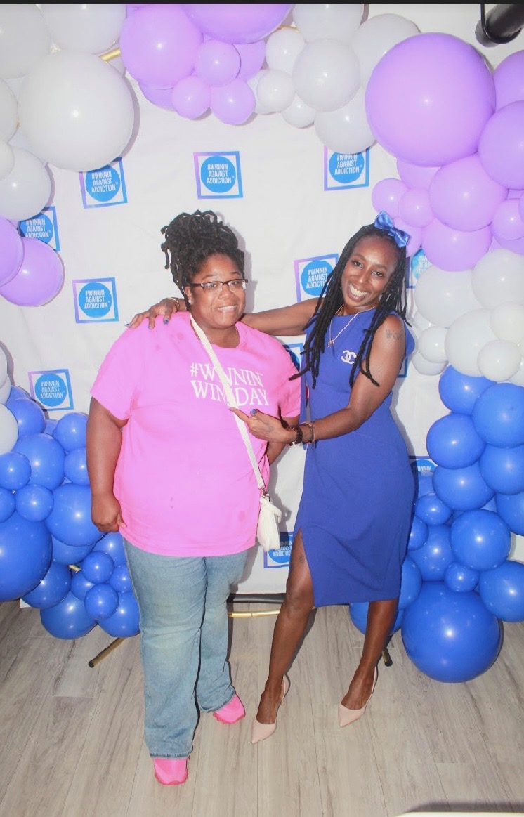 2024 community advocates in Winnin Against Addiction shirts celebrating at annual gala