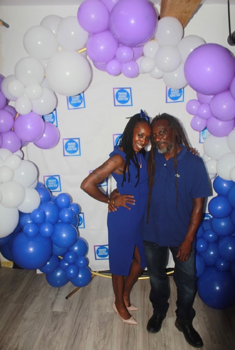 2024 Winnin Against Addiction gala attendees in front of branded photo wall at Boston event