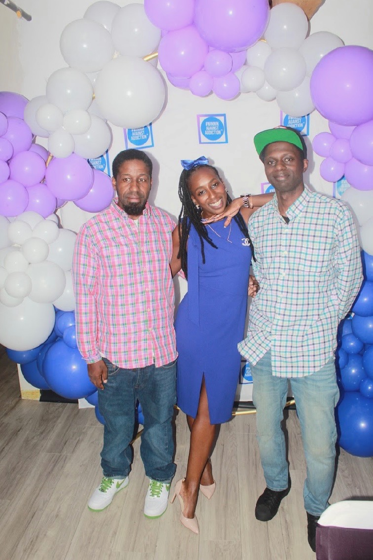 2024 gala community members celebrating recovery at Winnin Against Addiction event with purple balloons